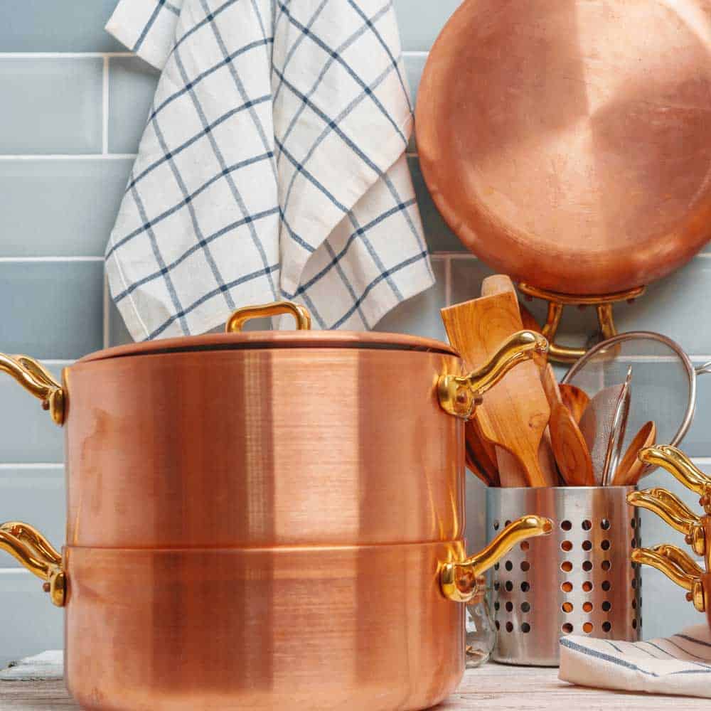gold colored pots and pans
